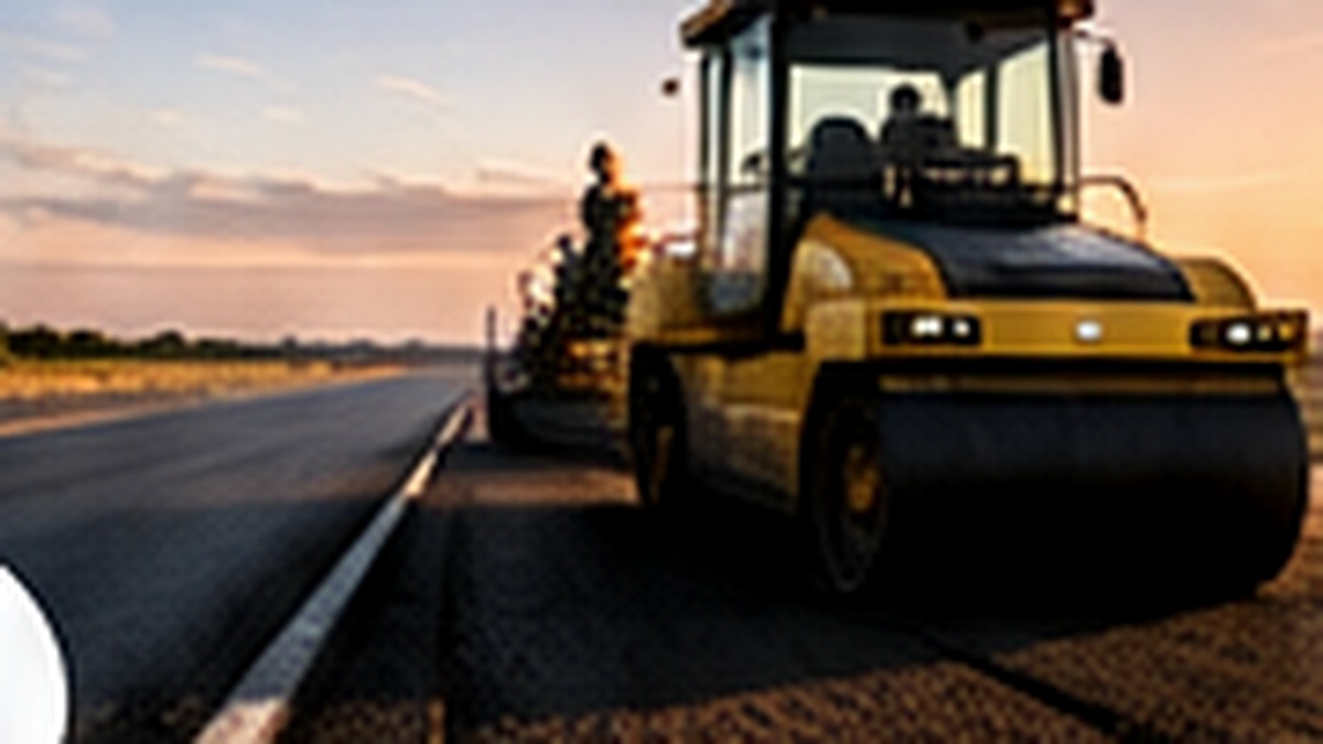 Road roller compacting a newly laid asphalt surface.